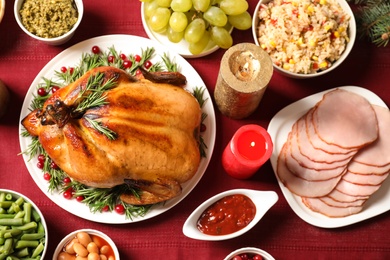 Photo of Traditional festive dinner with delicious roasted turkey served on table, flat lay