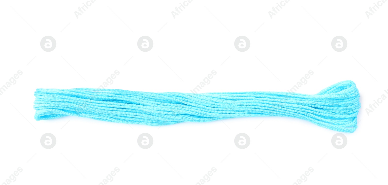 Photo of Light blue embroidery thread on white background