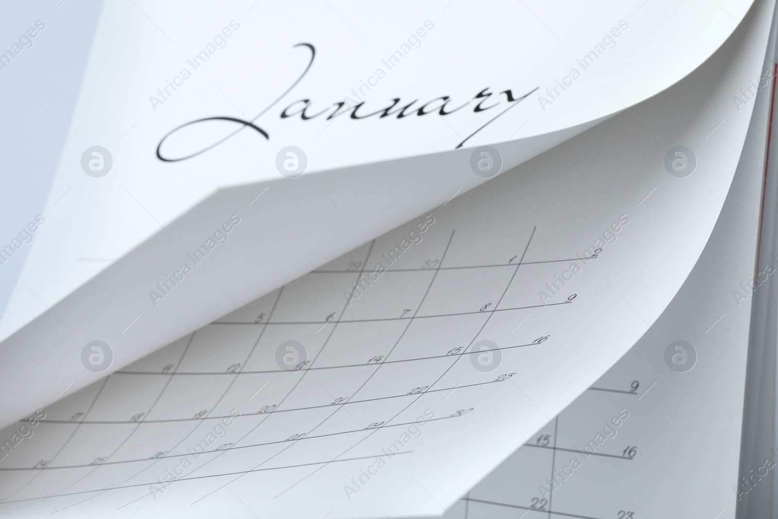 Photo of Closeup view of white paper office calendar
