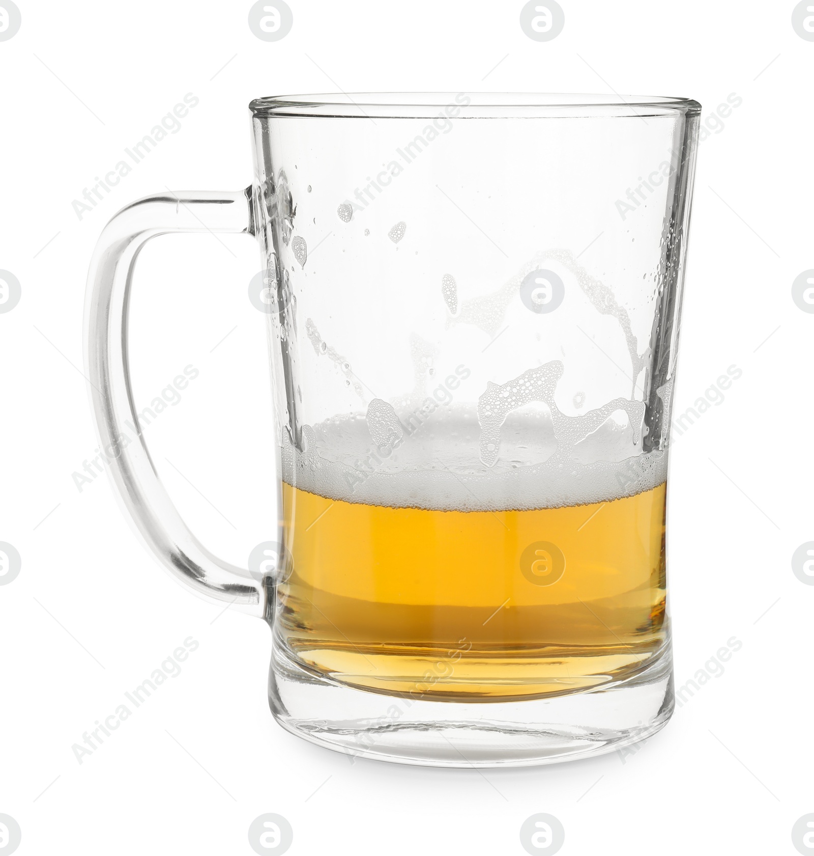 Photo of Half empty mug of beer isolated on white