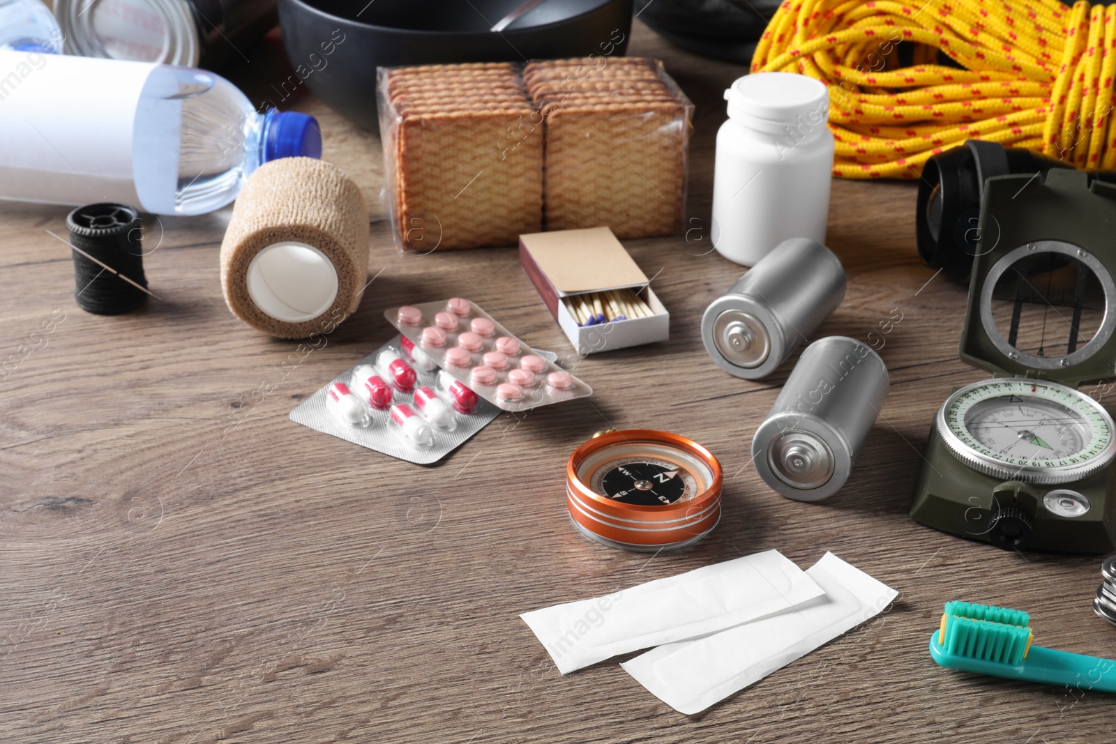 Photo of Disaster supply kit for earthquake on wooden table