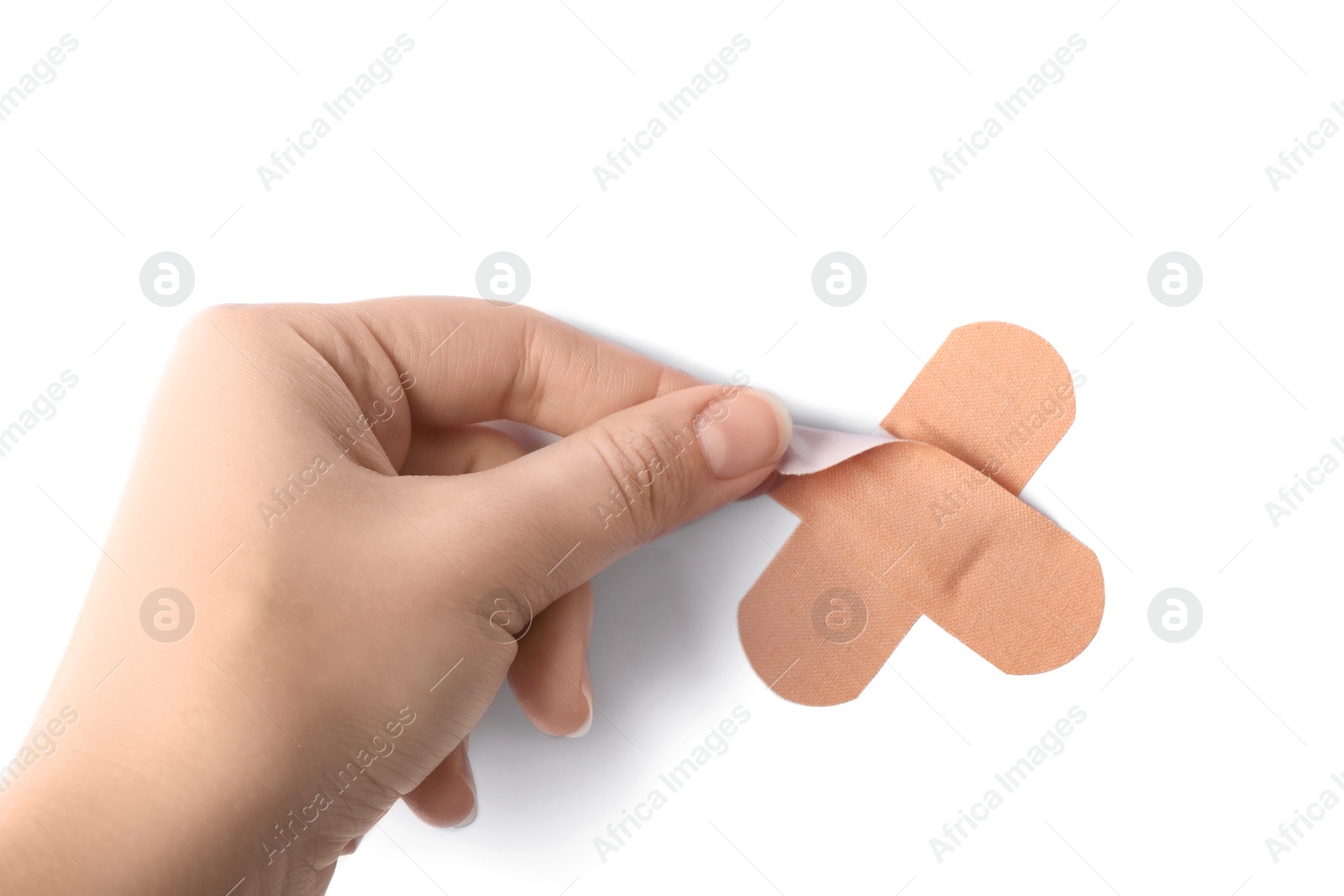 Woman putting sticking plaster on white background, top view. First aid item Photo of Woman putting sticking plaster on white background, top view. First aid item