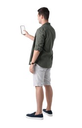 Man using smartphone with blank screen on white background