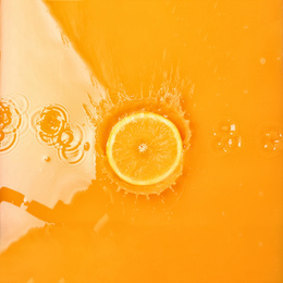 Photo of Delicious orange slice in juice, top view