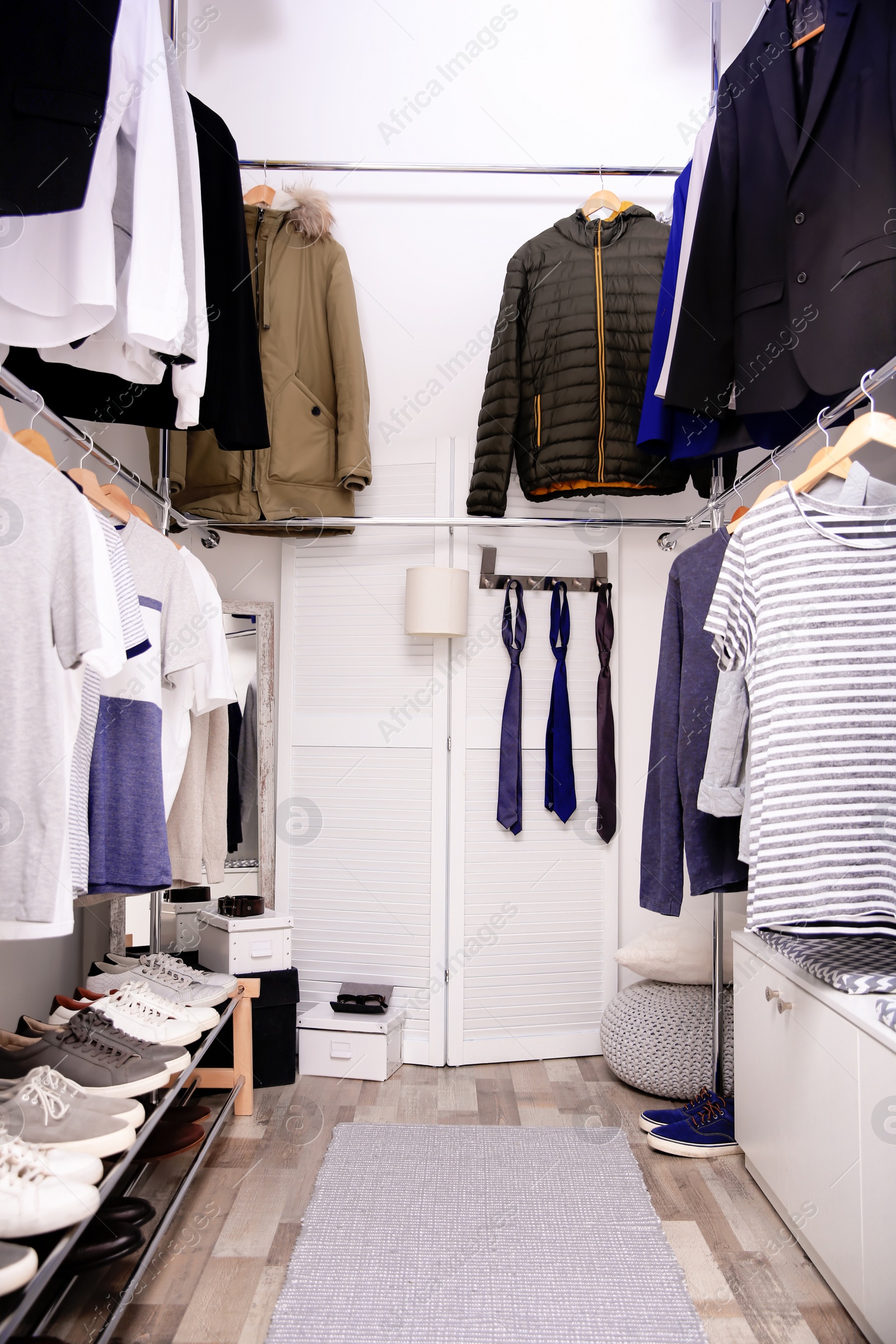 Photo of Modern dressing room with different stylish clothes and accessories