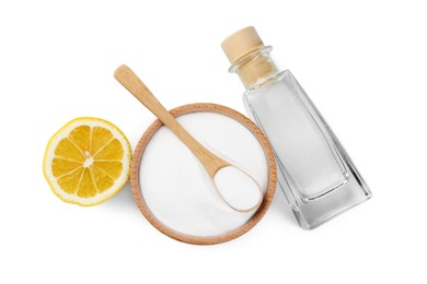 Photo of Baking soda, lemon and vinegar isolated on white, top view