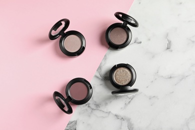 Photo of Flat lay composition with eye shadows on table