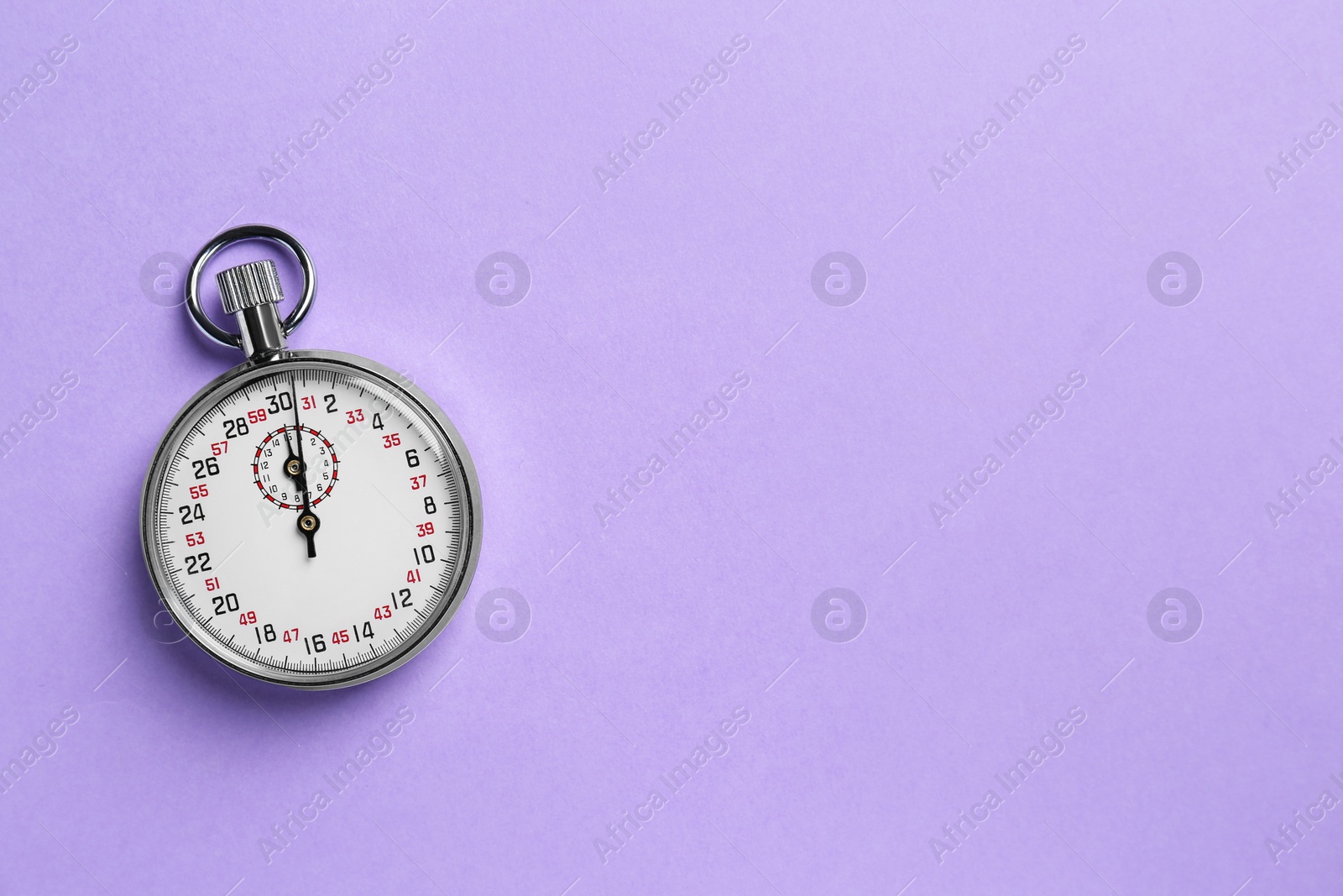 Photo of Vintage timer on violet background, top view. Space for text