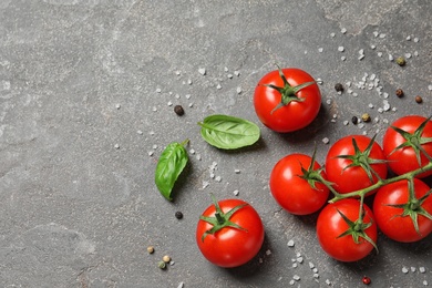 Photo of Flat lay composition with cherry tomatoes on stone background. Space for text