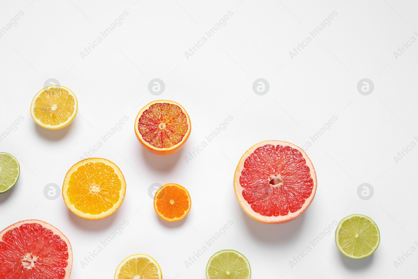 Photo of Flat lay composition with different citrus fruits on white background