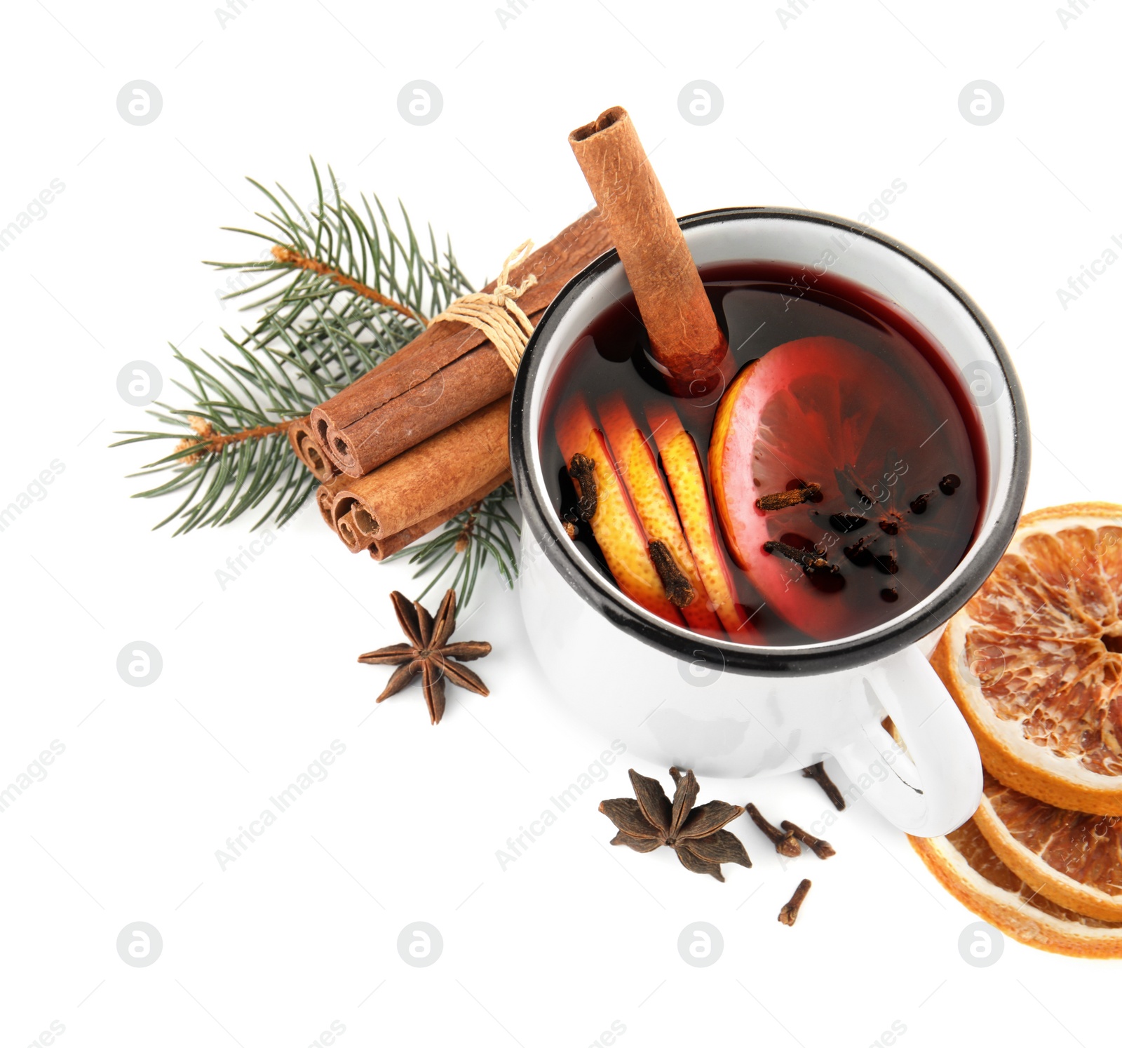 Photo of Composition with mug of mulled wine, cinnamon, orange and fir branch on white background