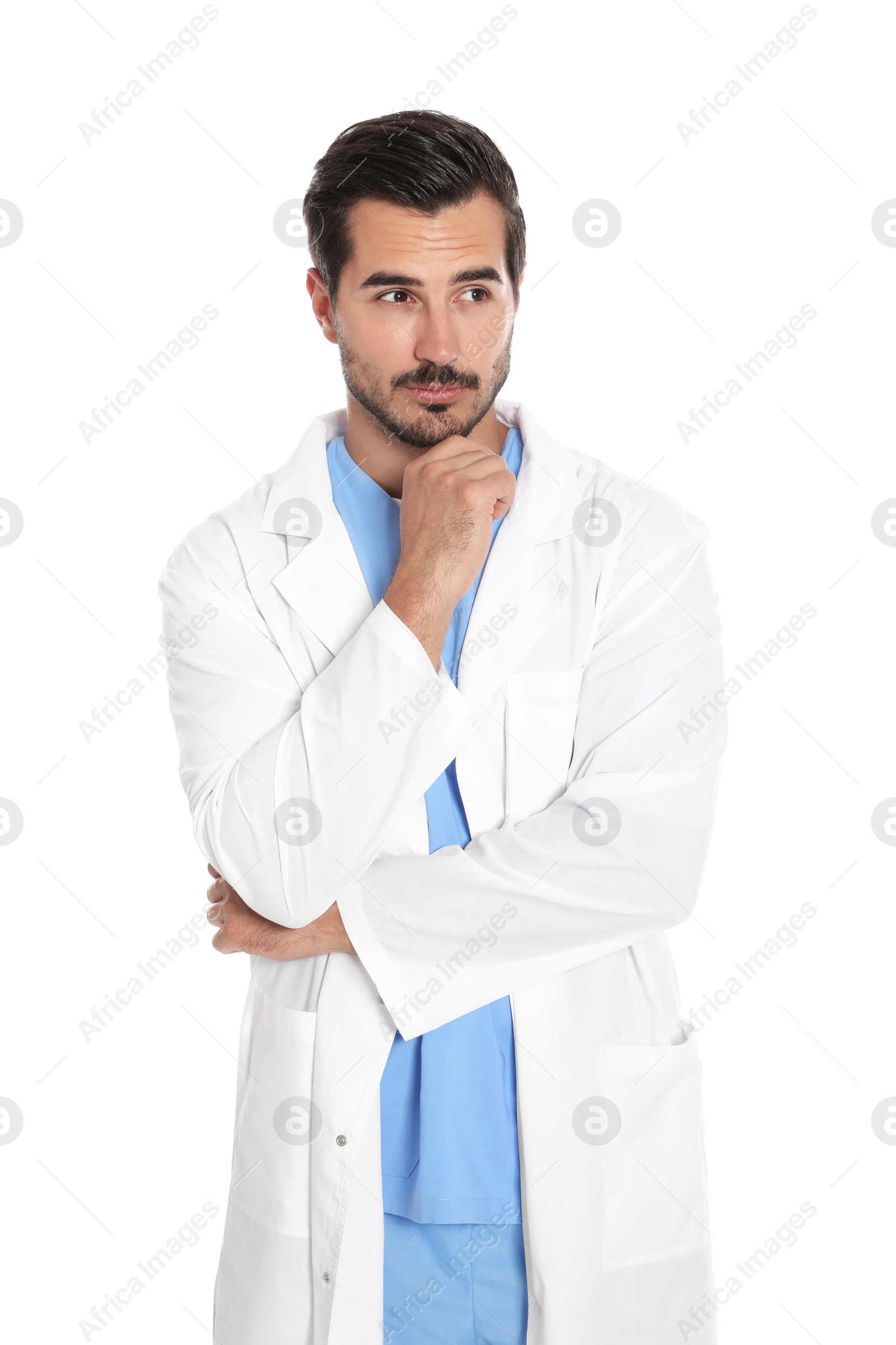 Photo of Young male doctor in uniform on white background. Medical service