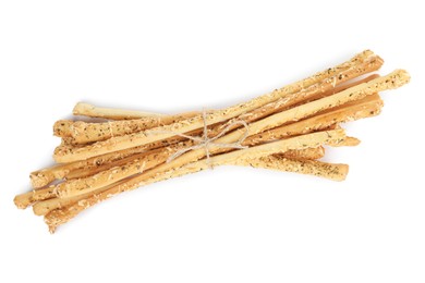 Fresh delicious grissini sticks on white background, top view