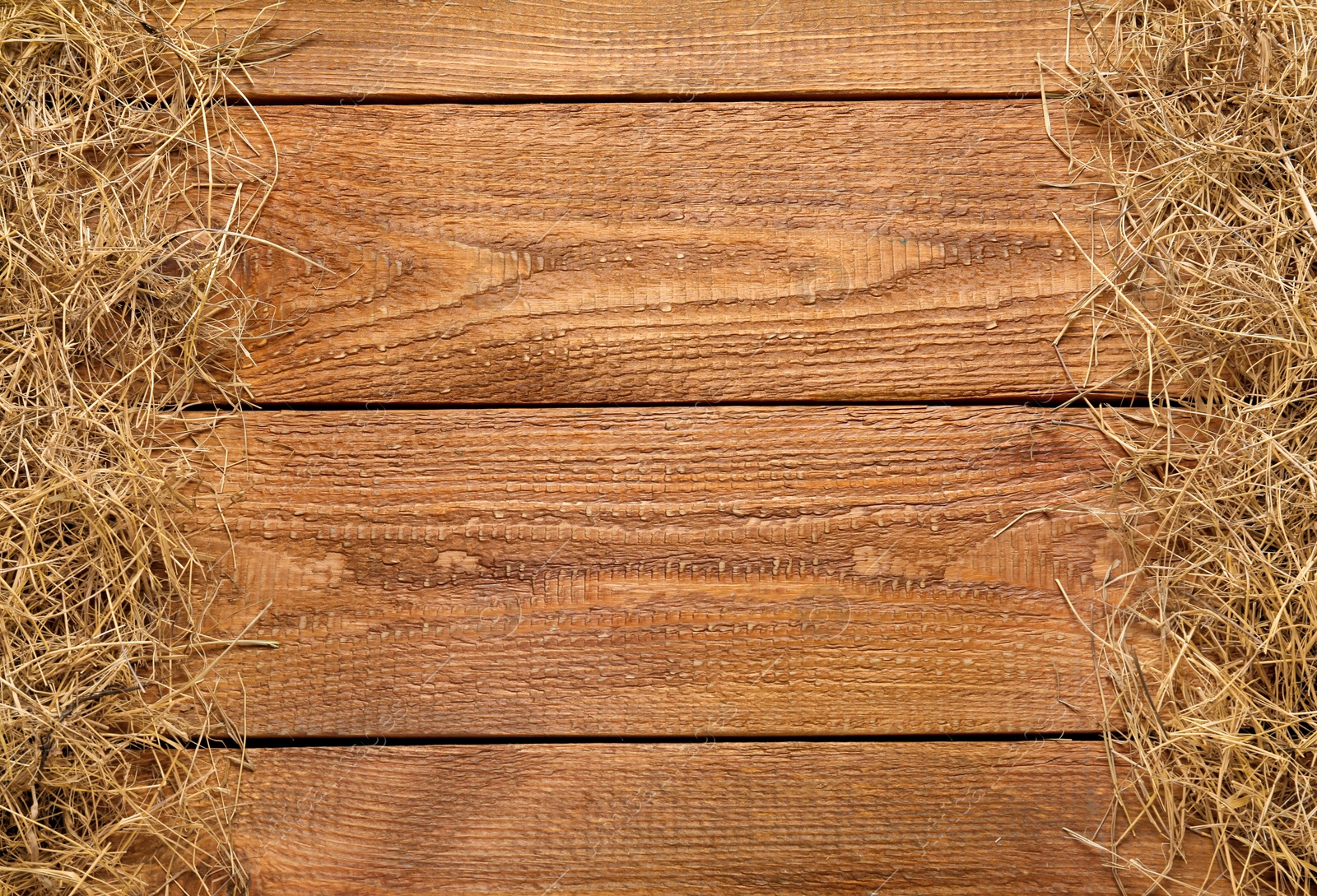 Photo of Dried hay on wooden background, flat lay. Space for text