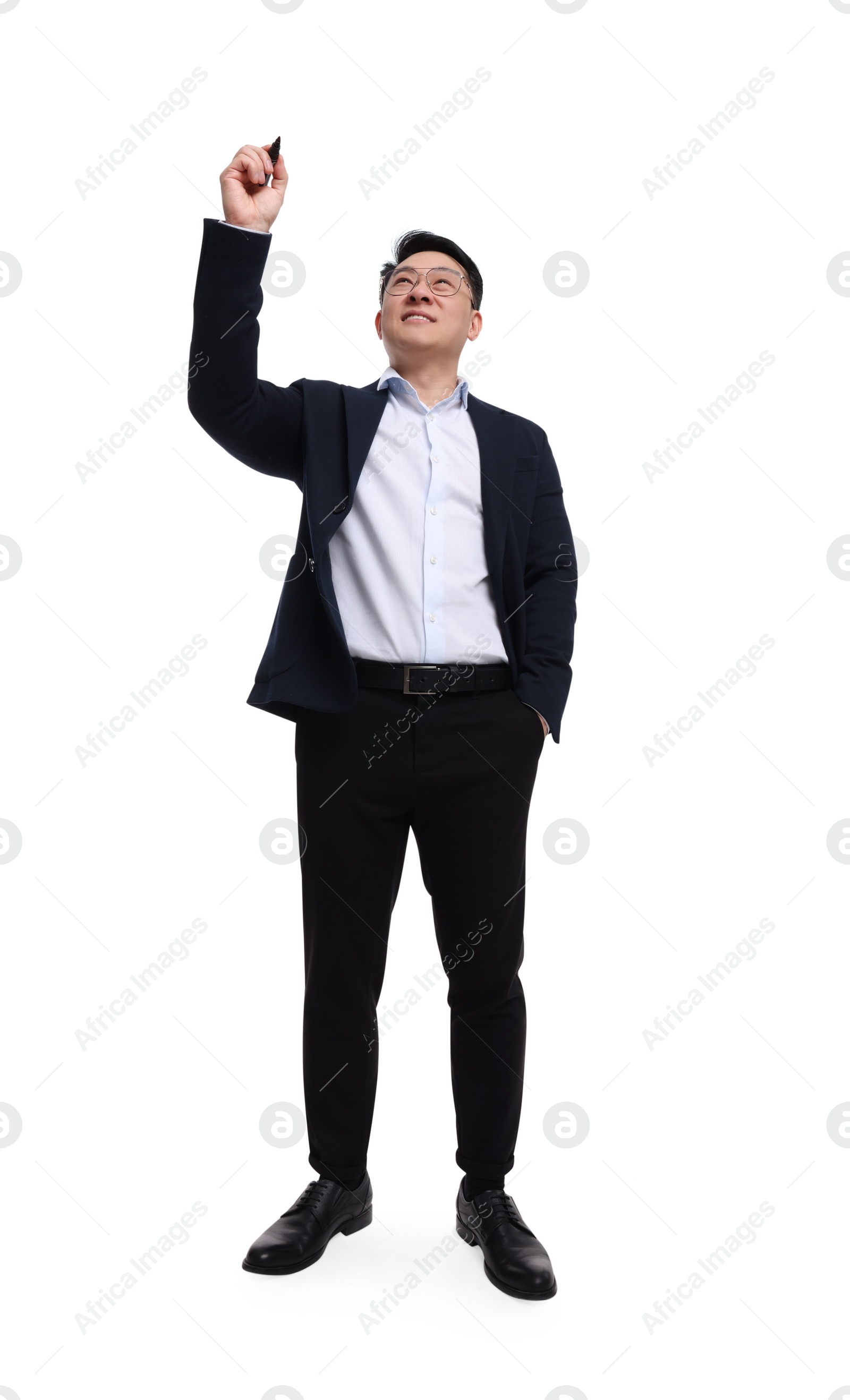 Photo of Businessman in suit with marker writing on white background, low angle view