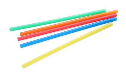 Photo of Color plastic cocktail tubes on white background