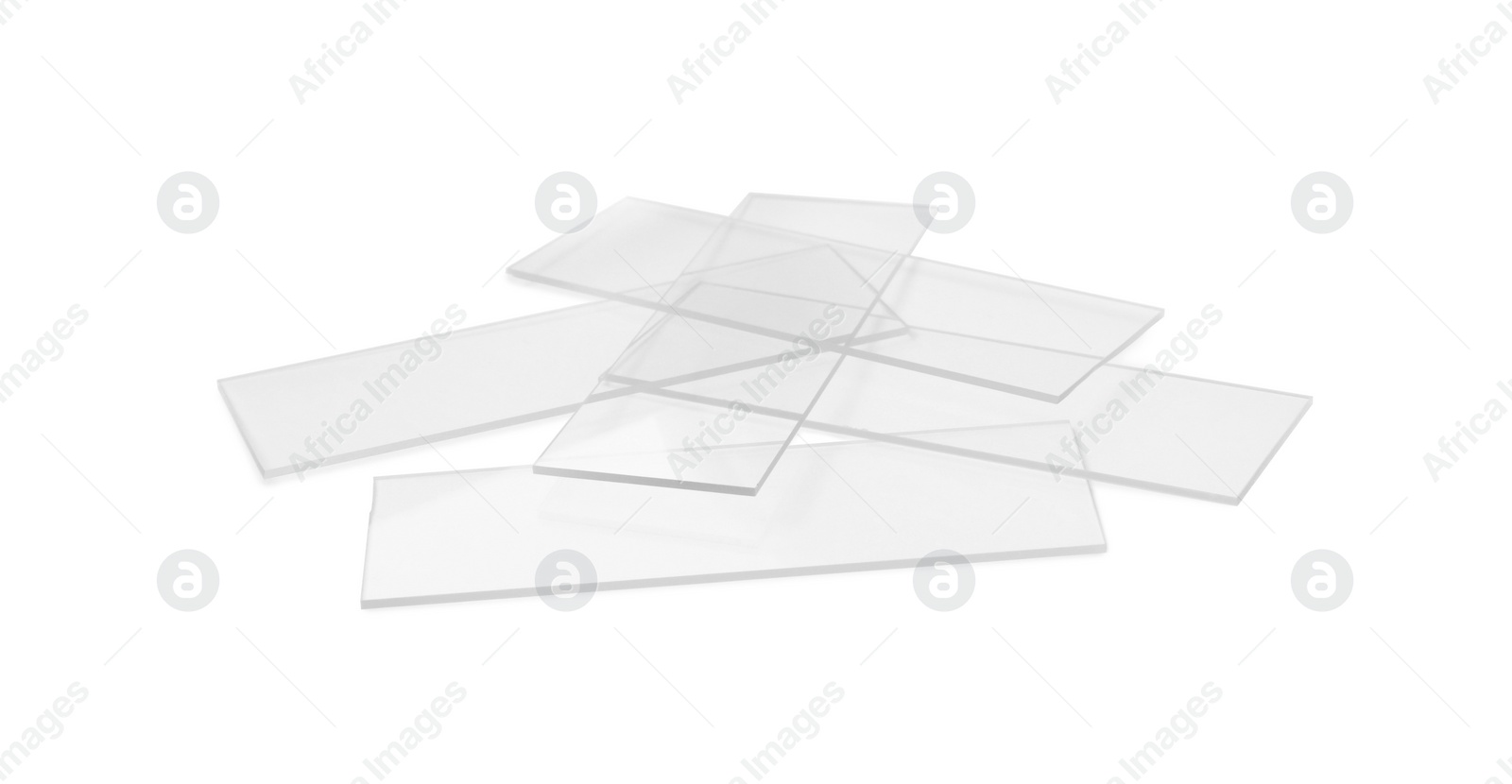 Photo of Pile of clean glass microscope slides on white background