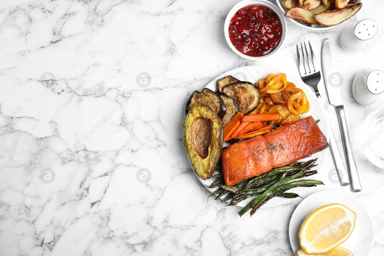 Photo of Tasty cooked salmon and vegetables served on white marble table, flat lay with space for text. Healthy meals from air fryer