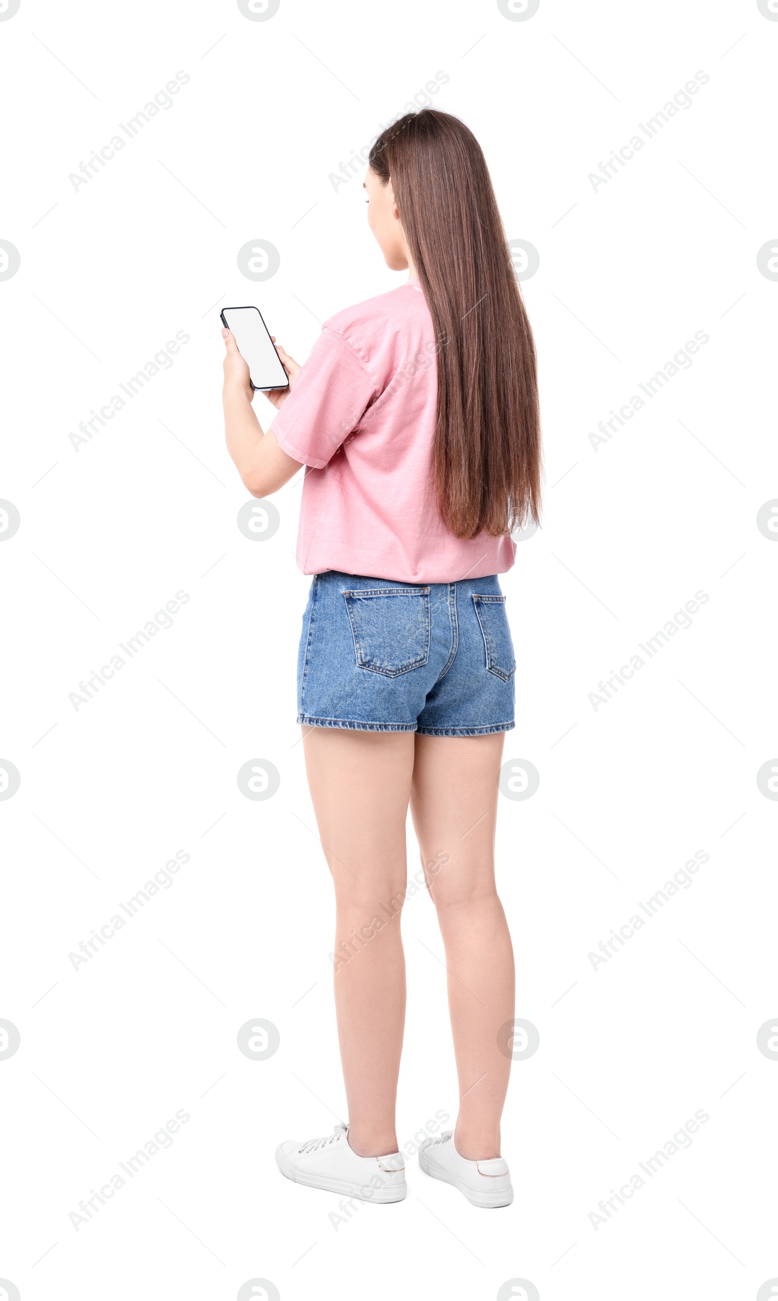 Photo of Woman holding smartphone with blank screen on white background, back view