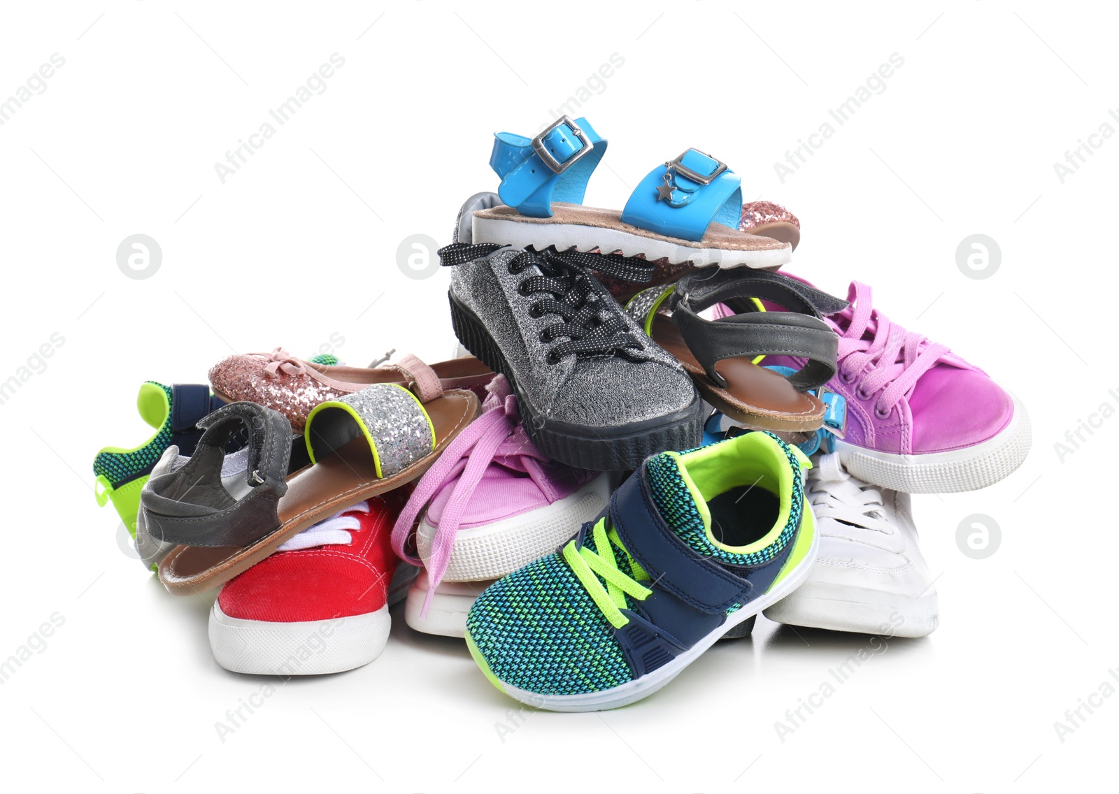 Photo of Pile of different shoes on white background