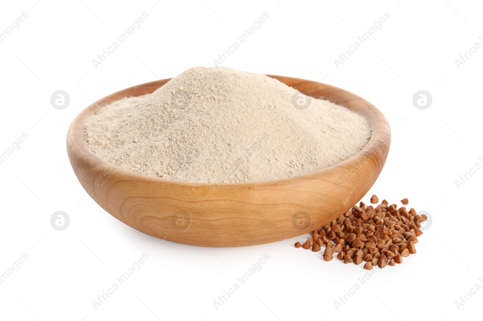 Photo of Bowl of buckwheat flour on white background