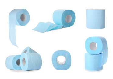 Set with blue rolls of toilet paper on white background