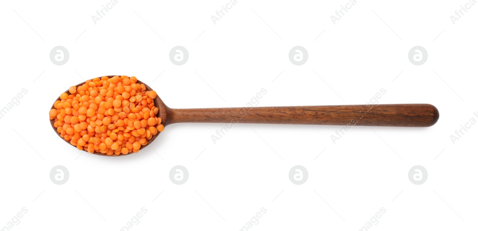 Photo of Wooden spoon with raw lentils isolated on white, top view