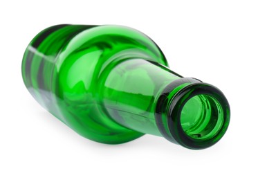 Photo of One empty green beer bottle isolated on white