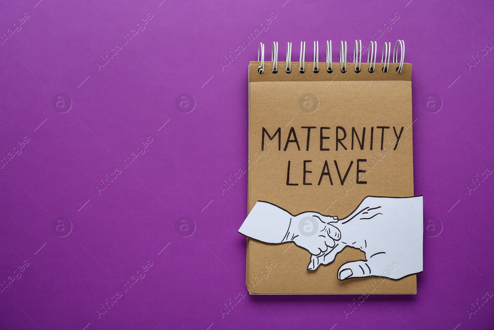 Photo of Notepad with words Maternity Leave and paper cutout of hands on purple background, top view. Space for text