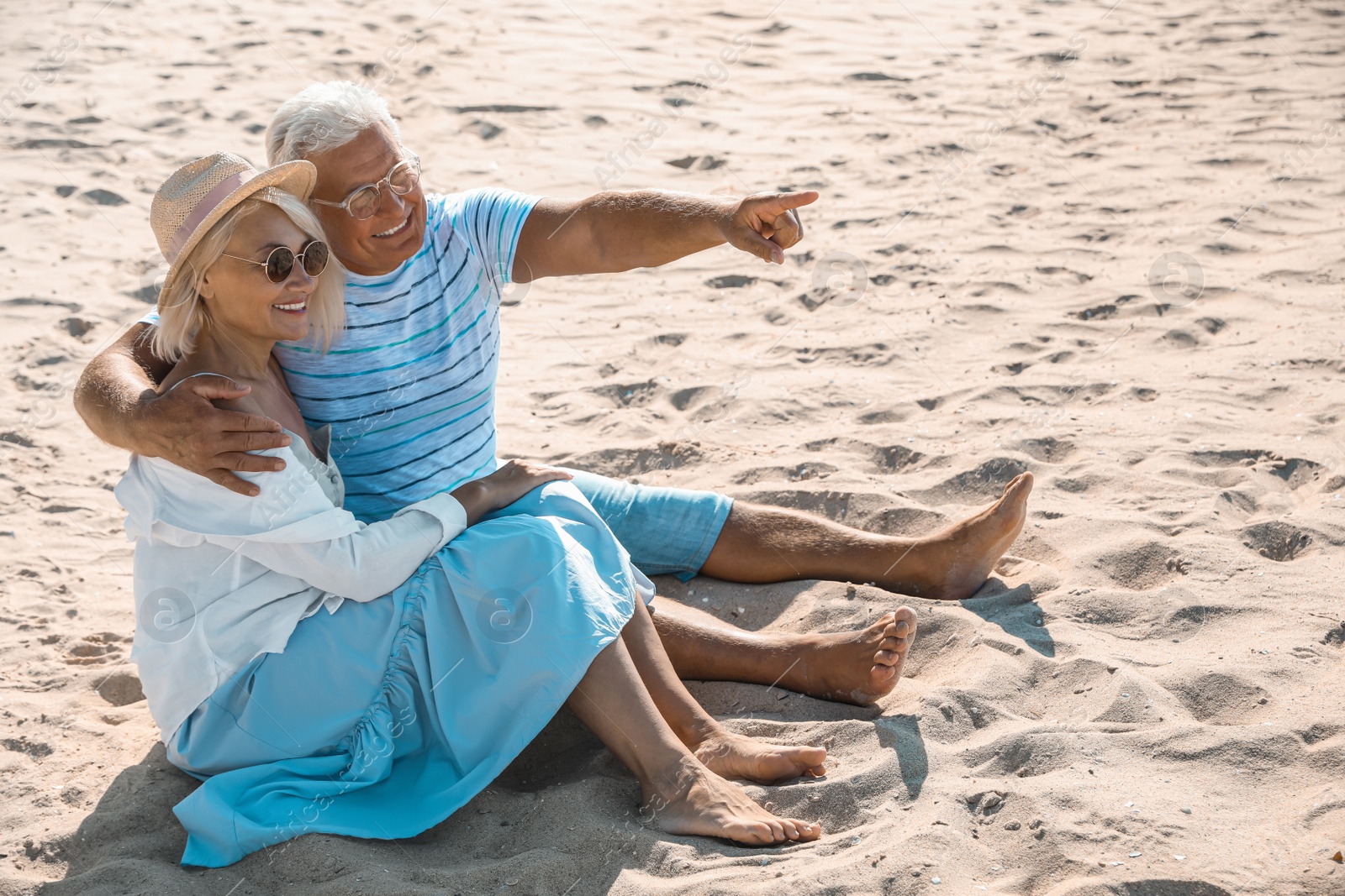 Photo of Mature couple spending time together on sea beach