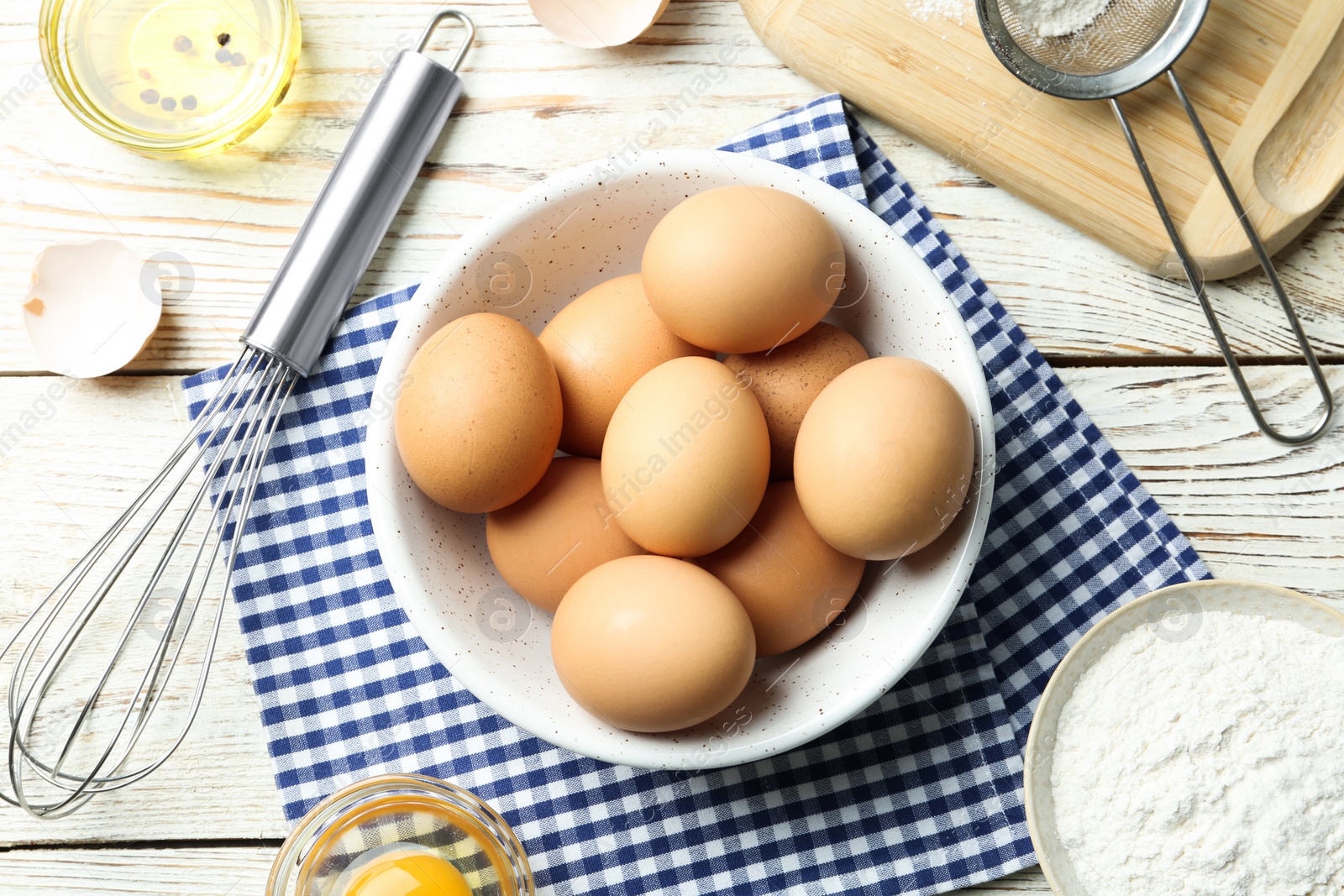 Photo of Flat lay composition with chicken eggs on white wooden table