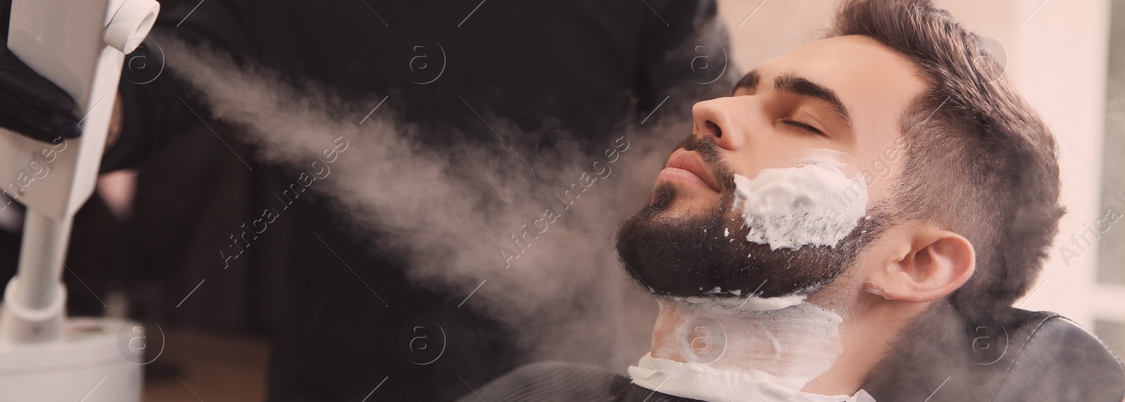 Image of Hairdresser working with client at barbershop. Banner design