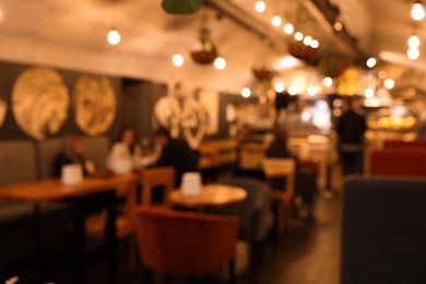 Photo of Blurred view of cafe interior with bokeh effect