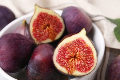 Bowl of tasty ripe figs, closeup view