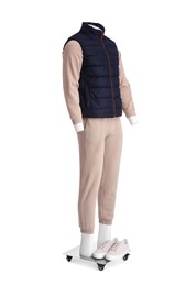 Photo of Male mannequin with shoes dressed in stylish beige tracksuit and vest isolated on white