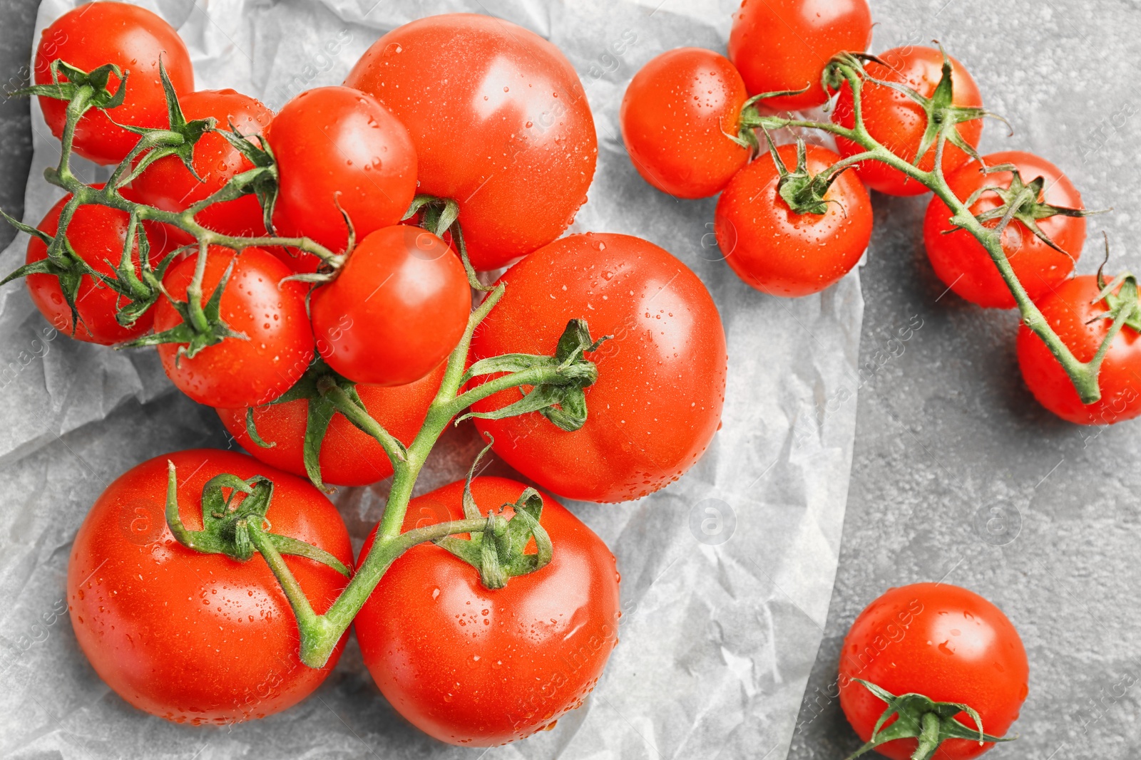 Photo of Fresh ripe red tomatoes on table, top view