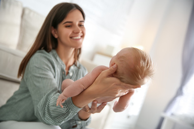 Mother with her newborn baby at home