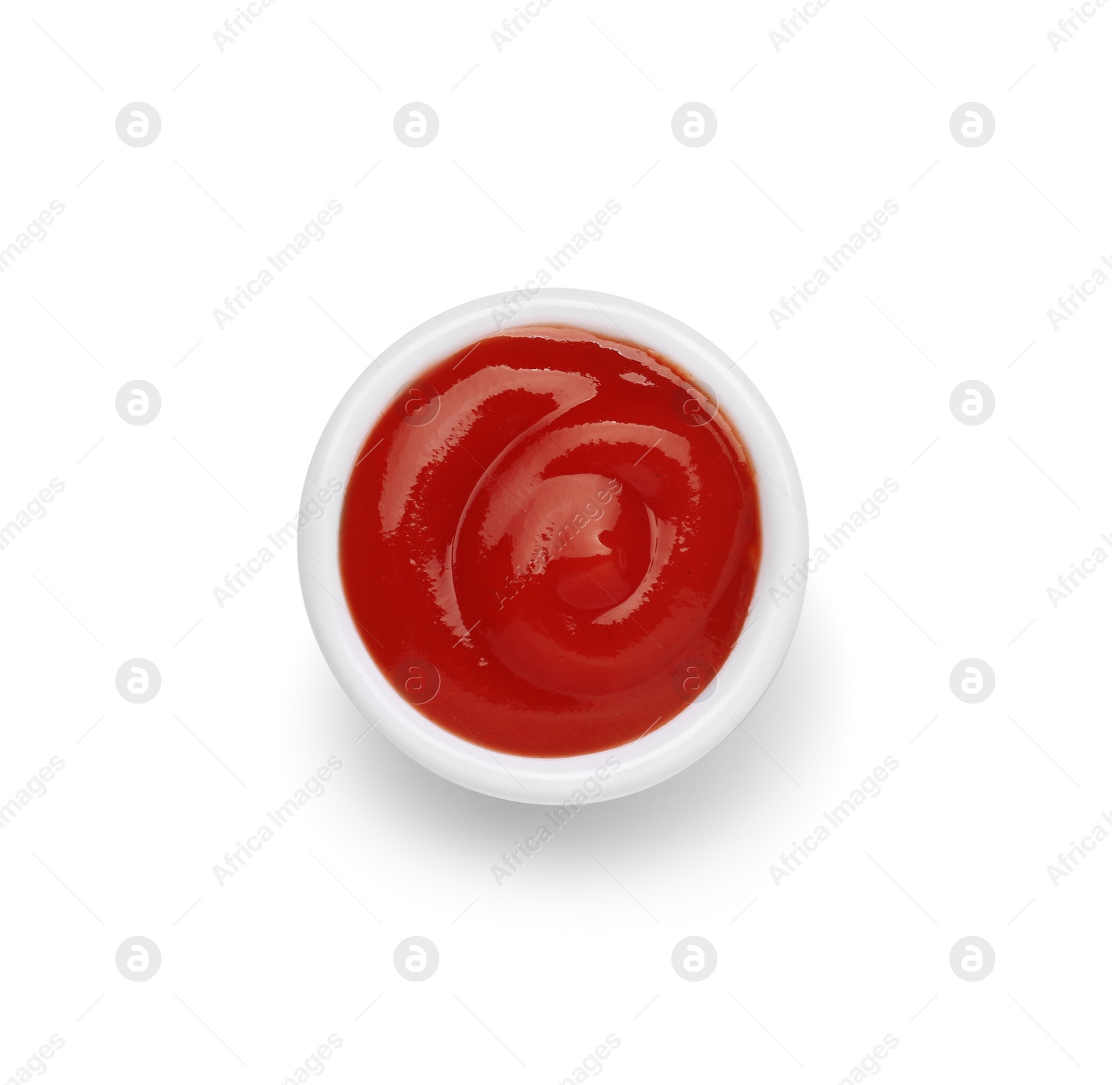 Bowl of tasty ketchup isolated on white, top view. Tomato sauce Photo of Bowl of tasty ketchup isolated on white, top view. Tomato sauce
