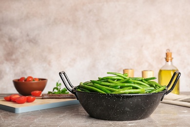 Photo of Dish with tasty green beans on table