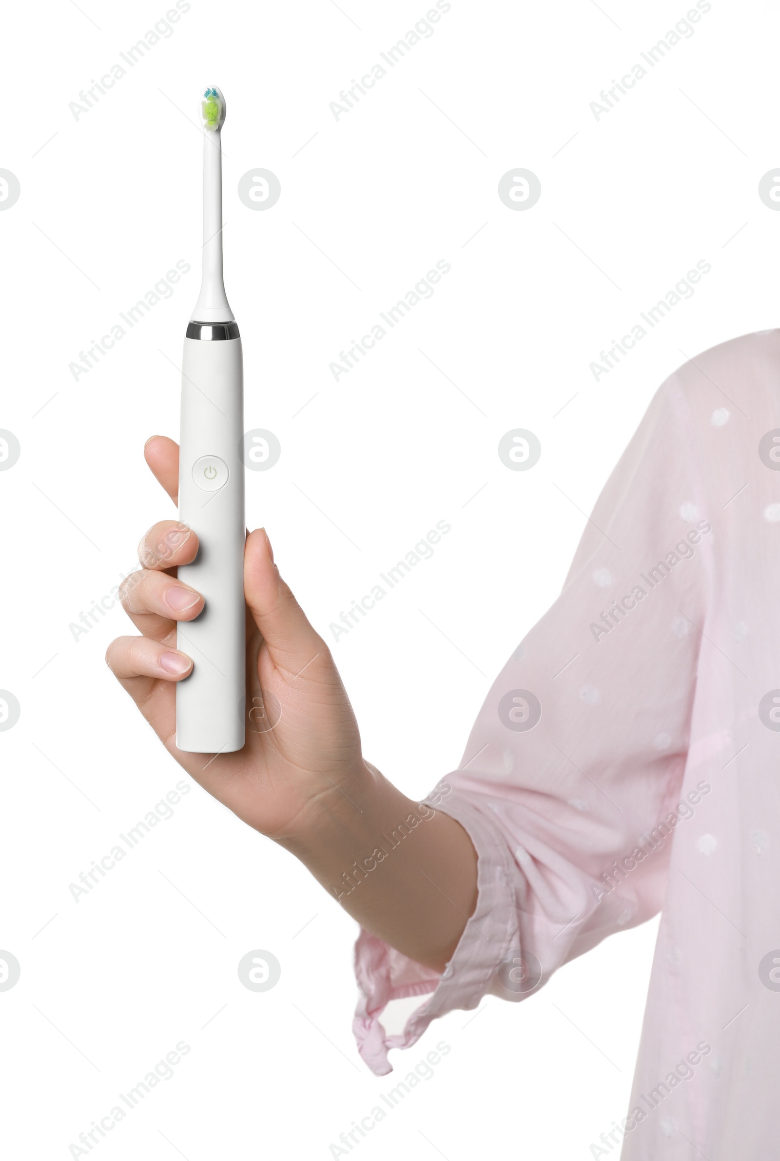 Photo of Woman holding electric toothbrush on white background, closeup