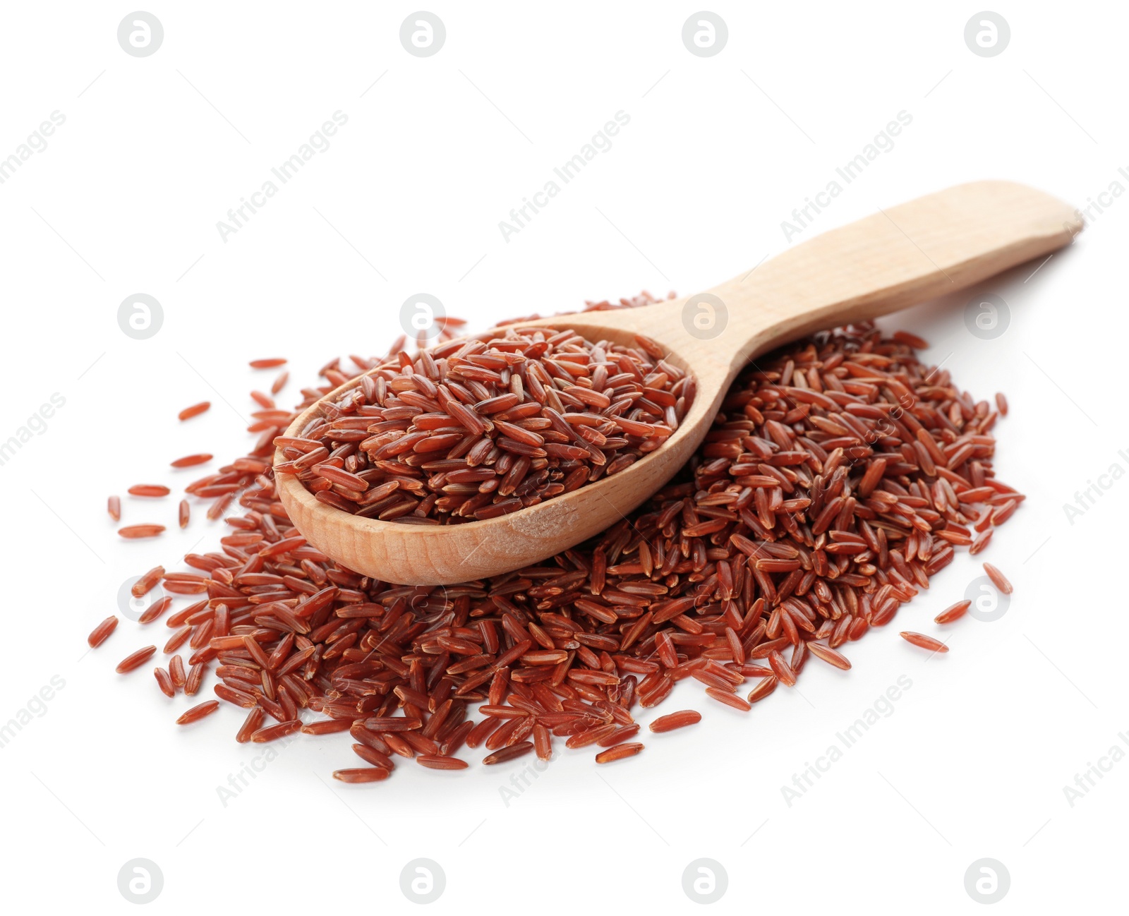 Photo of Heap of brown rice and wooden spoon on white background