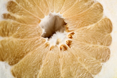 Photo of Fresh cut yellow pomelo fruit as background, closeup