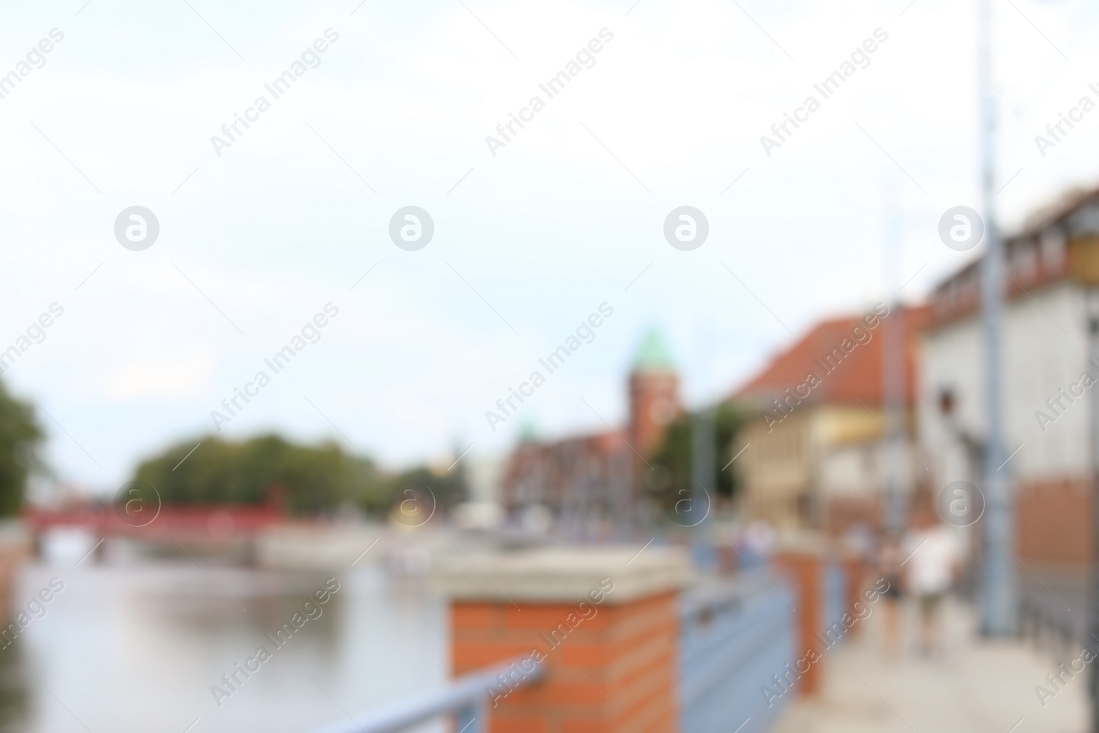 Photo of Blurred view of city street near river