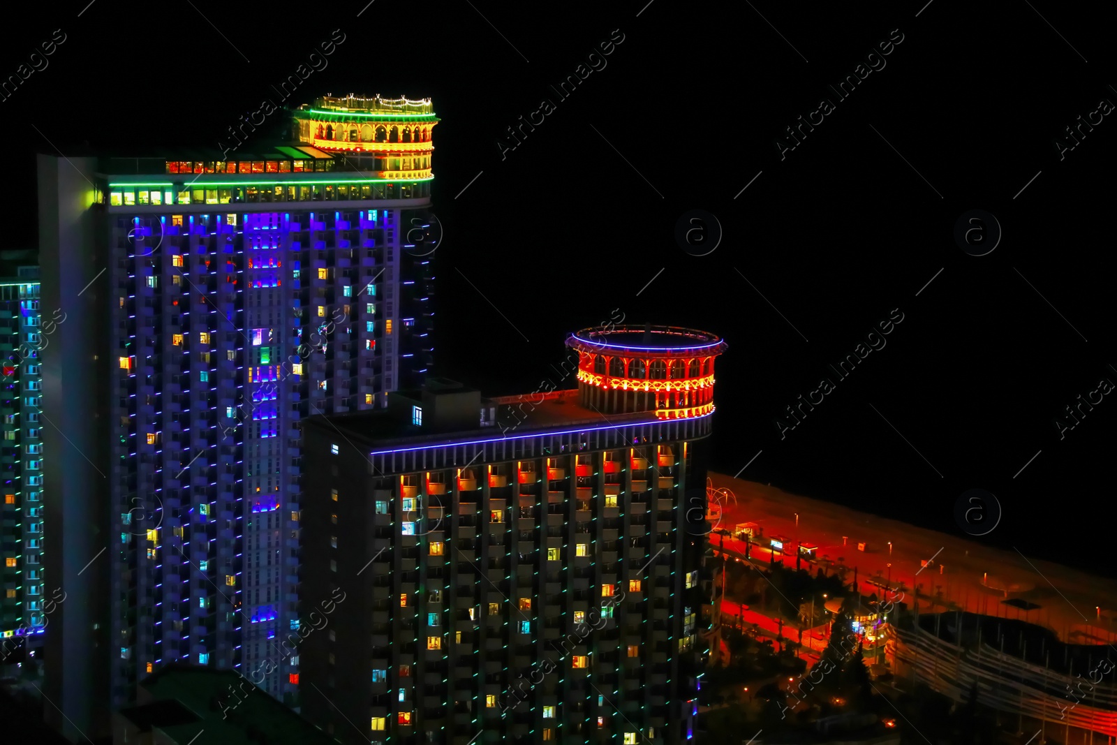 Photo of Picturesque view of city with buildings at night