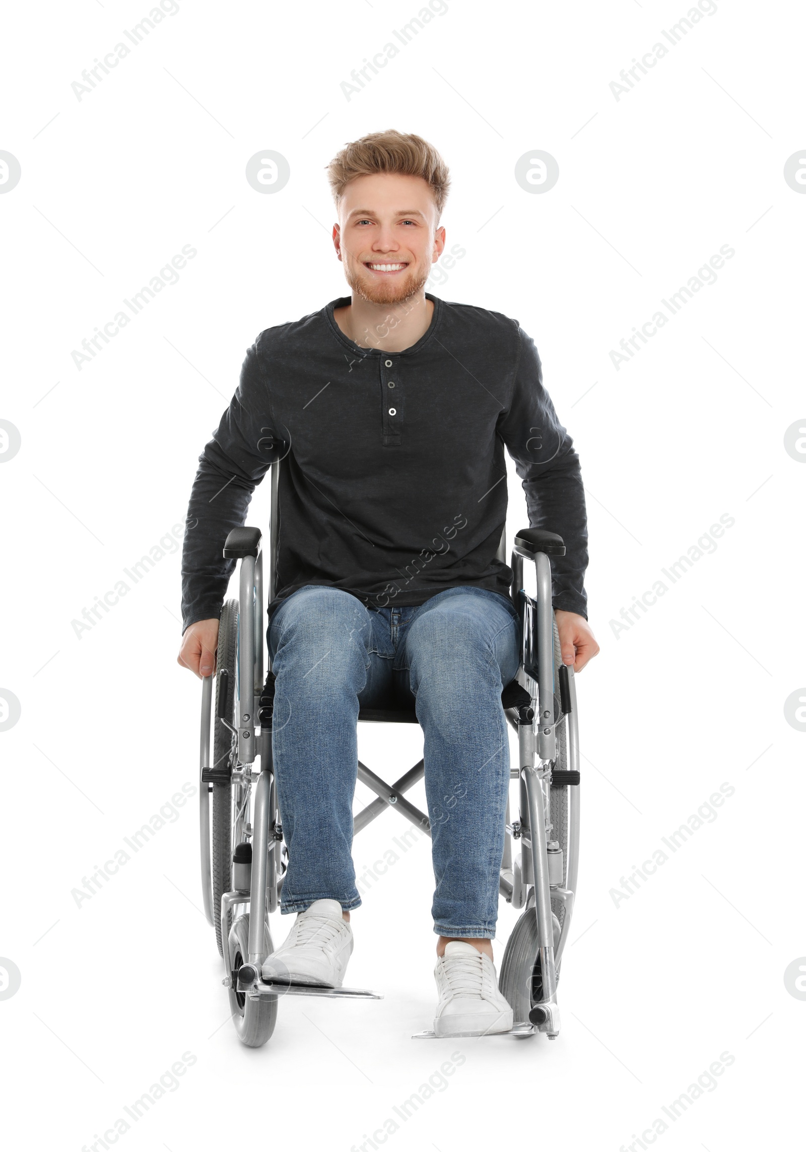 Photo of Handsome young man in wheelchair isolated on white