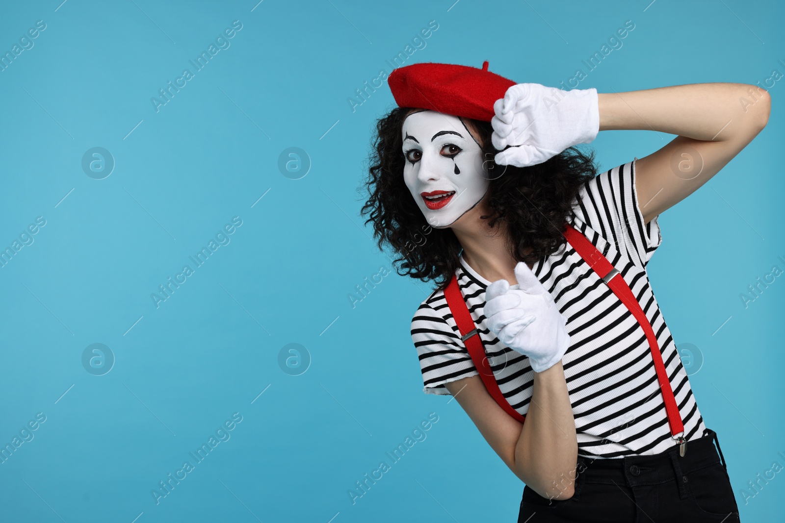 Photo of Funny mine with beret posing on light blue background, space for text