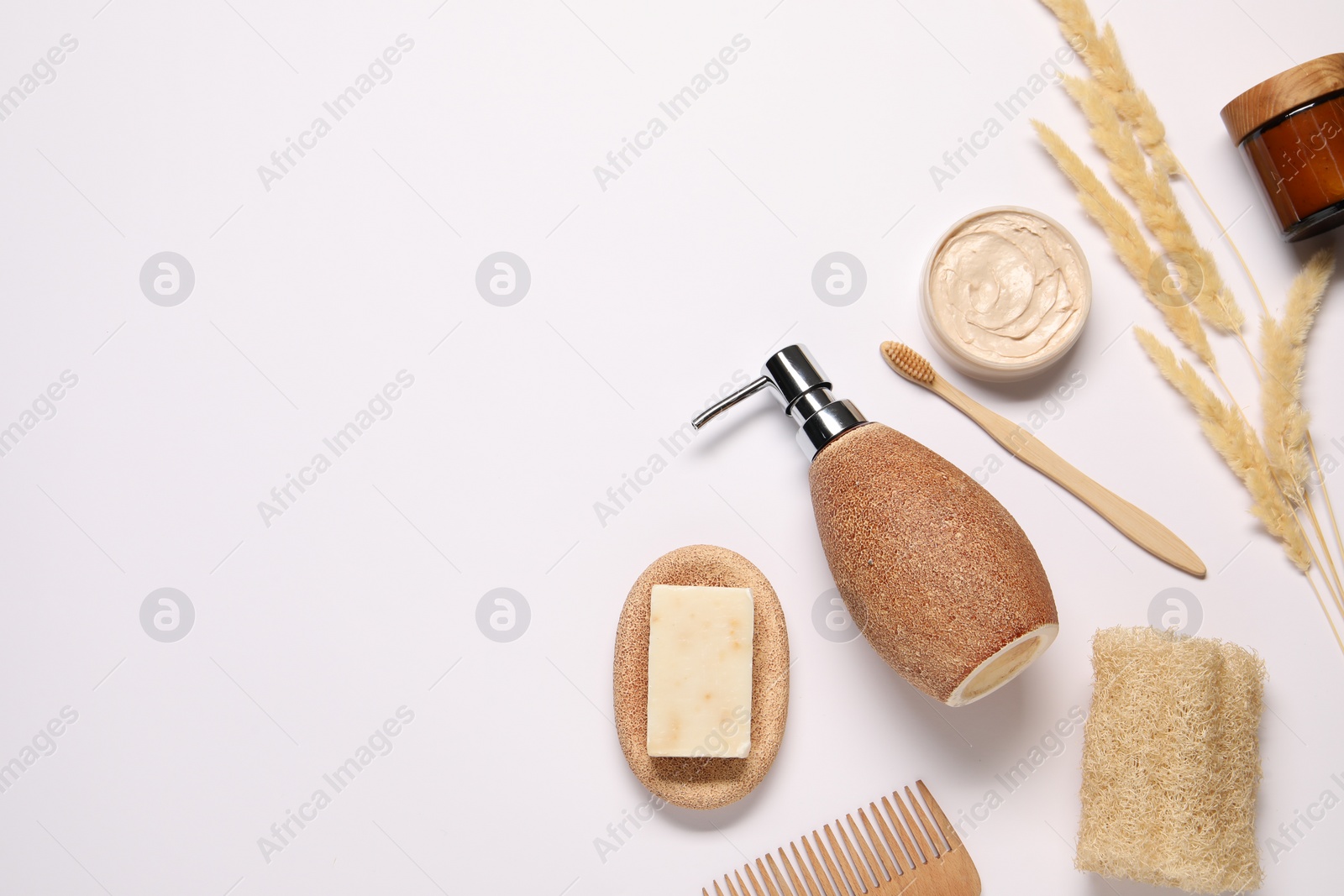 Photo of Bath accessories. Different personal care products and dry spikelets on white background, flat lay with space for text