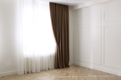 Photo of Window with elegant curtains in modern room