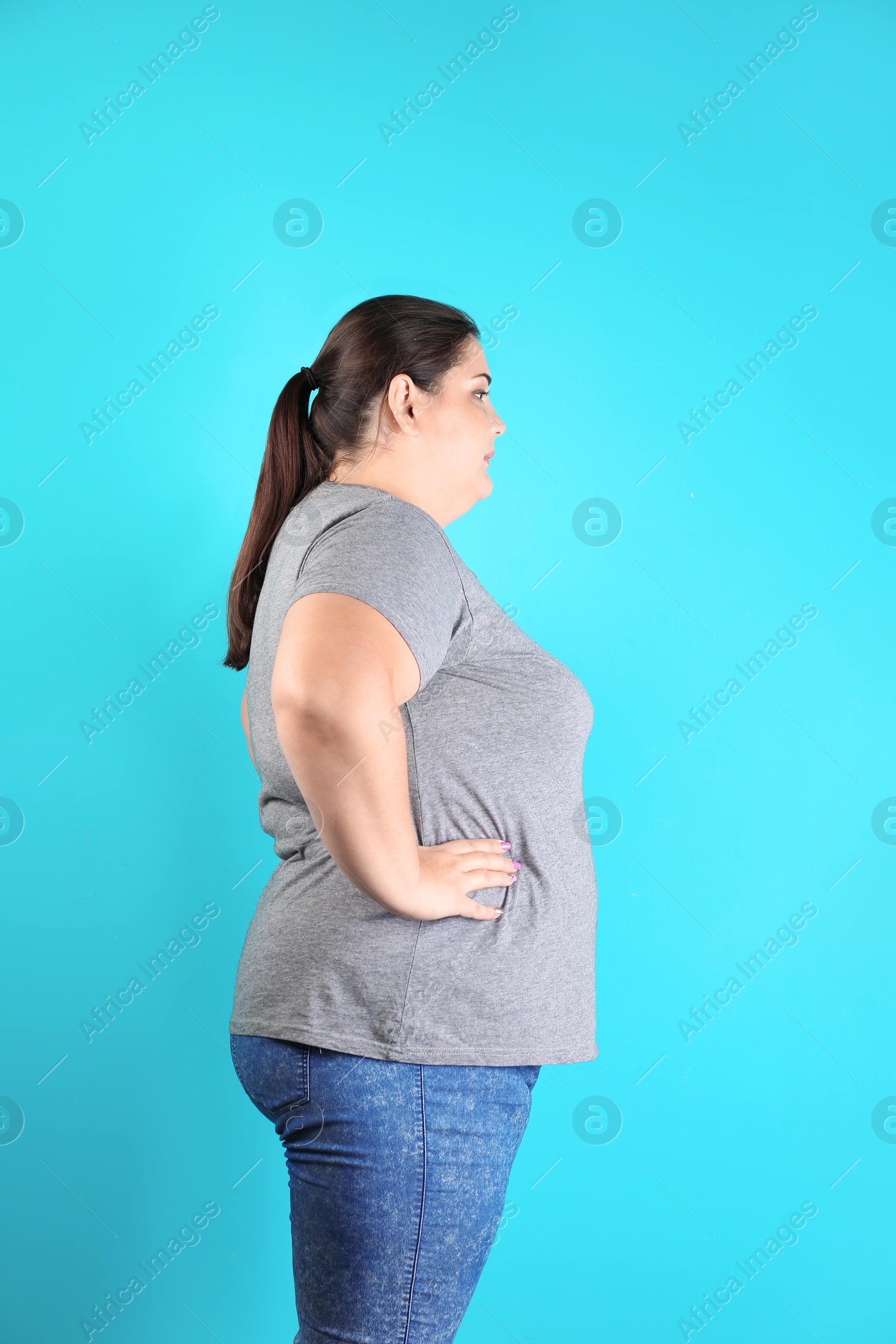 Photo of Overweight woman before weight loss on color background