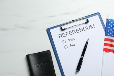 Photo of Referendum ballot with passport, pen and flag of USA on white marble table, flat lay. Space for text